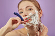© tugolukof - woman shaves her face