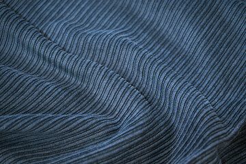 Wall Mural - Dark blue corduroy surface texture. Elegant background with space for design. Natural cotton ribbed fabric. Durable cloth. Close-up.