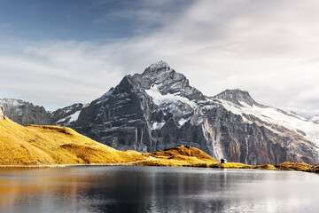 Wall Mural - bachalpsee lake in swiss alps mountains. snowy peaks of wetterhorn, mittelhorn and rosenhorn on back
