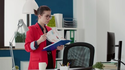 Poster - Project manager analyzing sales report on charts papers, doing research to create financial statistics in startup office. Company employee using documents and data statistics for business growth.