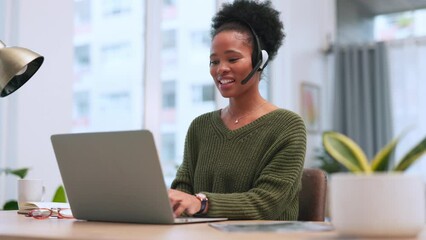 Poster - Confident black female call centre agent talking on a headset while working on a laptop in an office. Confident African American consultant operating a helpdesk for customer service and support