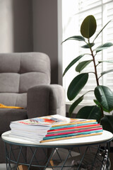 Canvas Print - Many stacked magazines on table in room