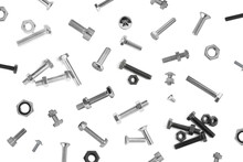 Many Different Bolts And Nuts Falling On White Background
