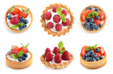 Wall Mural - Set of tasty sweet tartlets with fresh berries on white background