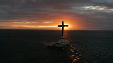 Catholic Cross In Sunken Cemetery In The Sea At Sunset, Aerial View. Colorful Bright Clouds During Sunset Over The Sea. Sunset At Sunken Cemetery Camiguin Island Philippines.
