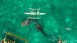 Tourists are watching whale sharks in the town of Oslob, Philippines, aerial view. Summer and travel vacation concept