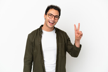 Wall Mural - Caucasian handsome man over isolated white background smiling and showing victory sign