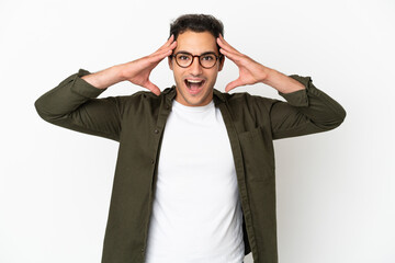 Wall Mural - Caucasian handsome man over isolated white background with surprise expression