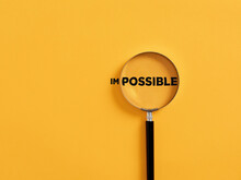Magnifier Focuses On The Possible Side Of The Word Impossible.