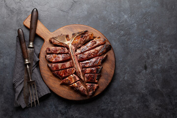 Wall Mural - Grilled porterhouse beef steak. Sliced T-bone