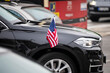 Small American Flag with stars and stripes on the luxury black car. Diplomatic car of USA. Officials of US embassy in Serbia, meeting of country ambassadors.