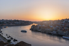 Portugal, Porto District, Vila NovadeGaia, Douro River And Surrounding City At Sunset