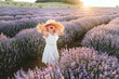 © Westend61 - Sad girl wearing hat shouting amidst lavender plants