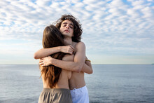 Young Topless Girlfriend And Boyfriend Embracing Each Other In Front Of Sea