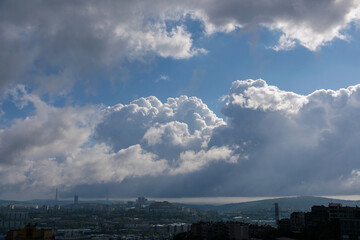 Fototapete - Cityscape view with beautiful white clouds.