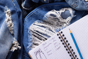 Wall Mural - Jeans denim with designer drawing sketches. Blue jeans as background texture