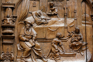 Wall Mural - Basilica of St. Denis. Stalls of the Goillon's Chapel (beginning of the 16th century). Depiction of family life scenes.