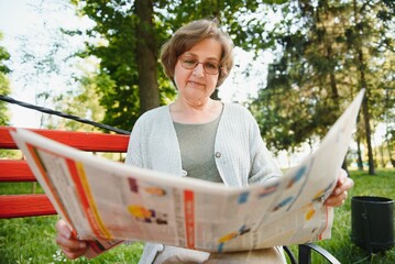 Poster - Portrait of a happy Senior woman in summer park