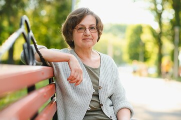 Sticker - Portrait of a happy Senior woman in summer park