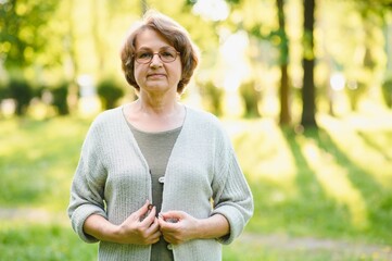 Sticker - Portrait of a happy Senior woman in summer park