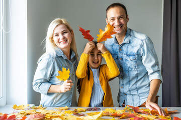 Wall Mural - Happy family doing autumn decor. Fall atmosphere