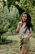 © Striker777 - Portrait of Young Beautiful Smiling woman  in   a Vineyard with a glass of  rose Wine. Woman  enjoiyng  the summer vacation
