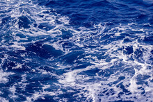 The Swirling Blue Waves Of The Mediterranean Sea, After The Passage Of A Ship.
