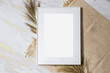 © Katarzyna - Mock up poster. Minimal template with empty picture frame mock up. White background, boho