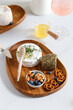 Camembert and Caciotta cheese with provencal herbs. Serving Cheese plate with nuts and honey. Cheese and wine concept.