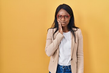 Sticker - African young woman wearing glasses touching mouth with hand with painful expression because of toothache or dental illness on teeth. dentist