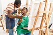 © Krakenimages.com - African american painter couple smiling happy painting at art studio.