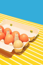 Bright Image Of Eggs In Box On Bright Yellow Tablecloths Isolated On Blue Background. Village Breakfast