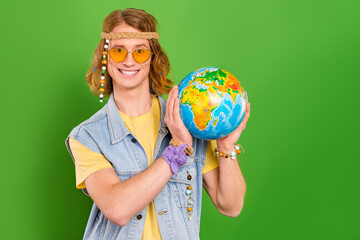 Canvas Print - Photo of guy tourism hold globe earth advertise peace environmental care wear jeans vest isolated bright color background