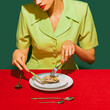 © master1305 - Cropped image of woman eating oyster on red tablecloth isolated over green background. Delicious taste