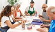 © Krakenimages.com - Group of middle age draw students sitting on the table drawing at art studio.
