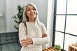 © Krakenimages.com - Middle age grey-haired woman smiling confident standing with arms crossed gesture at home