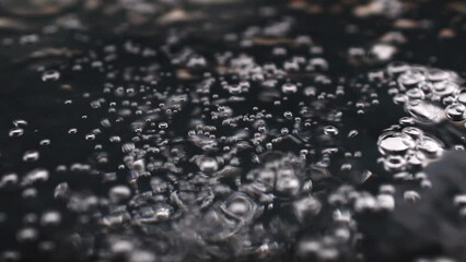 Poster - Boiling water bubbles on the surface.