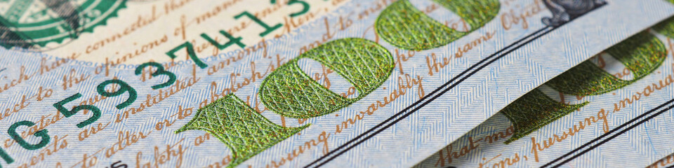Wall Mural - american banknotes of one hundred dollars. fragment of bills close-up. new sample money. focus on th