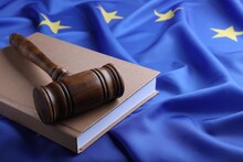 Wooden Judge's Gavel And Book On Flag Of European Union, Space For Text