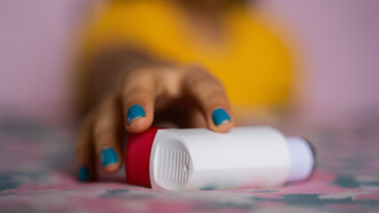 Asthmatic patient catching inhaler having an asthma attack. Young woman having asthma, chronic obstructive pulmonary disease