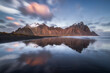 © Erika Valkovicova - Vestrahorn mountain reflection in the sea in Iceland