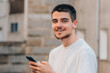 © carballo - young man with mobile phone