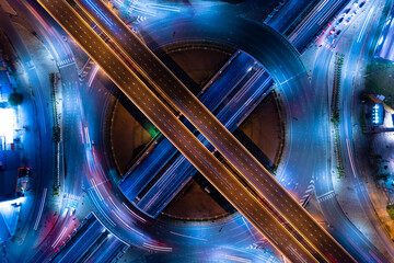 Poster - Aerial view of car traffic transportation above circle roundabout road of Drone aerial view fly , high angle. Public transport or commuter city life concept of economic and energy, infrastructure	
