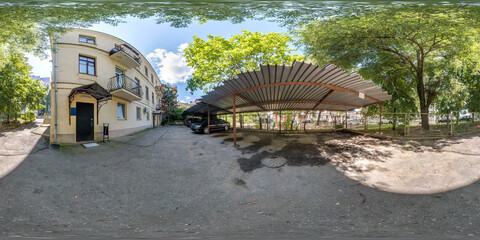  full seamless hdri panorma 360 angle view on parking with cars near buildings provincial town at summer sunny day in equirectangular spherical projection.  VR content