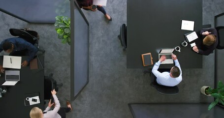 Aufkleber - A productive team of corporate employees working together in the office from above. Multitasking colleagues collaborating, networking and discussing new ideas for a successful startup company