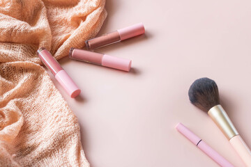 Make up products on pink background.