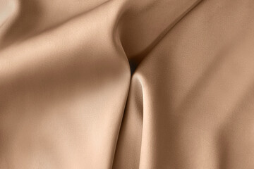 luxury light brown beige color creased smooth satin silk cloth texture decorate background with mini