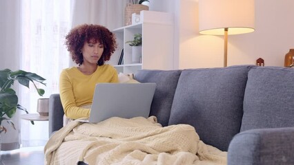Poster - Female entrepreneur or freelancer brainstorming and planning business ideas using her laptop. Woman typing an email and browsing online on a laptop while relaxing on the couch at home alone.