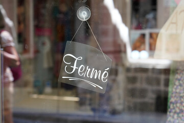 Wall Mural - ferme vintage black panel door windows shop sign fermé in french text means closed board store