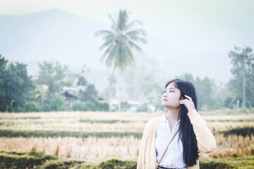 girl standing in the countryside morning 2